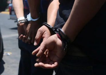 PN captura dos hombres por robo en banca de lotería en el sector 27 de Febrero, Distrito Nacional